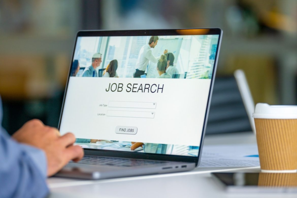 Close up of a Businessman looking at a job search recruitment web page.